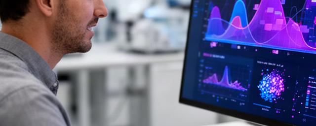 Ingeniero revisando un modelo de IA generativa en un monitor con gráficos de rendimiento
